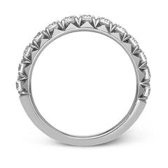 This band pairs perfectly with an engagement ring, or can be worn on its own or stacked with other rings. It contains .75 ctw of white diamonds.