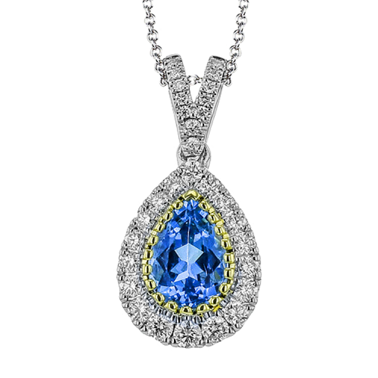 This elegant, vintage-inspired pendant glimmers with .28 ctw of round white diamonds and a .72 ctw pear shaped emerald, all set in sophisticated two-tone gold.