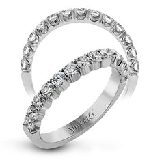 This classic wedding band contains a stunning .75 ctw of white round diamonds