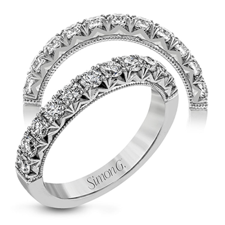 This classic wedding band features a distinctive setting style that shows off the .75 ctw of white diamonds to their full advantage.