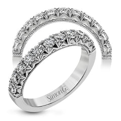 This classic wedding band features a distinctive setting style that shows off the .75 ctw of white diamonds to their full advantage.