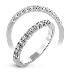 This classic wedding band features a distinctive setting style that shows off the .35 ctw of white diamonds to their full advantage.