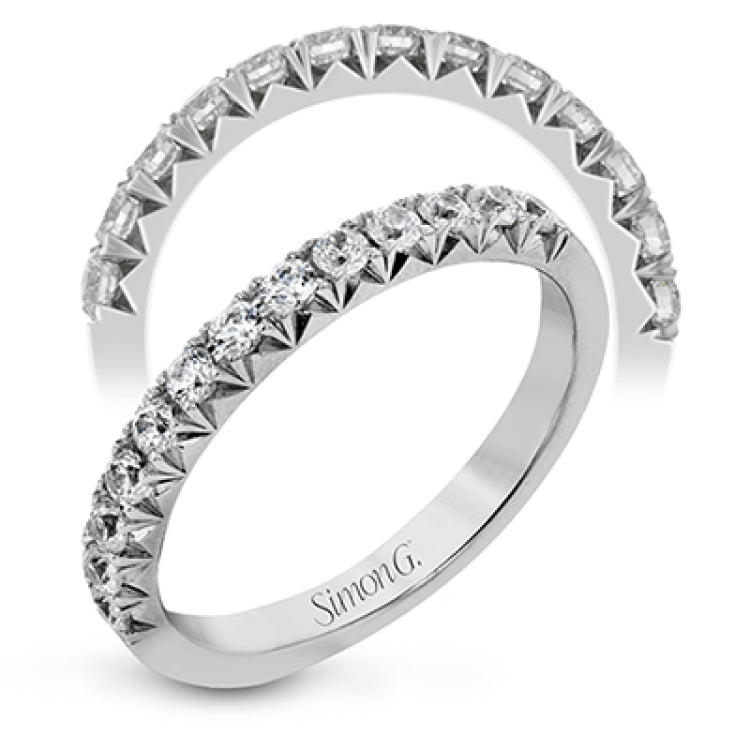 This band pairs perfectly with an engagement ring, or can be worn on its own or stacked with other rings. It contains .50 ctw of white diamonds.