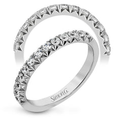 This band pairs perfectly with an engagement ring, or can be worn on its own or stacked with other rings. It contains .50 ctw of white diamonds.