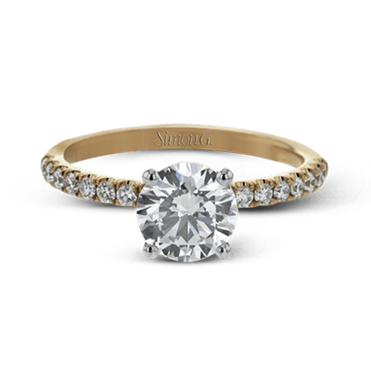 This distinctive bridal set design features a double-layer wedding band that fits around the engagement ring. The set contains .77 ctw of white diamonds.