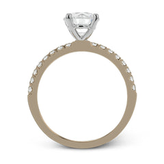 This distinctive bridal set design features a double-layer wedding band that fits around the engagement ring. The set contains .77 ctw of white diamonds.