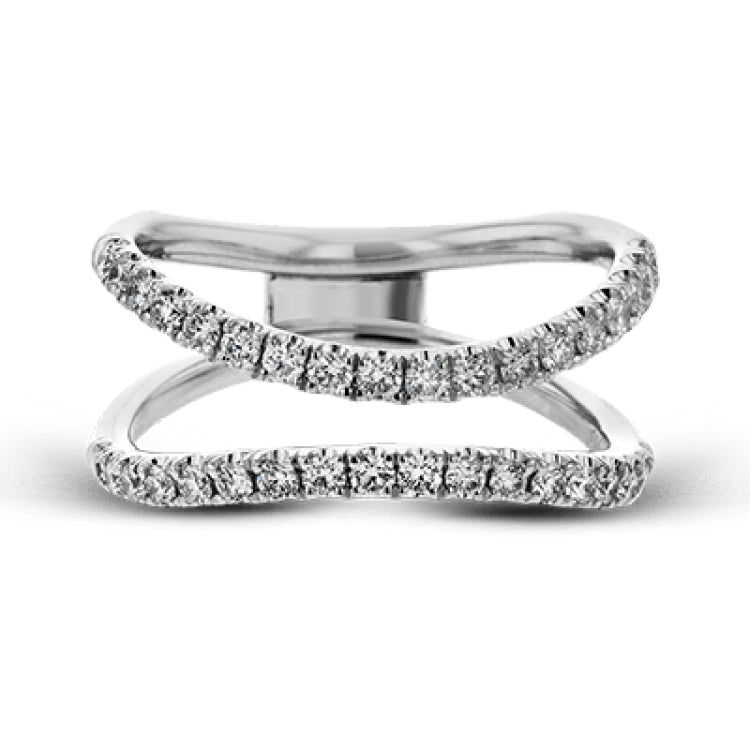 This distinctive bridal set design features a double-layer wedding band that fits around the engagement ring. The set contains .77 ctw of white diamonds.