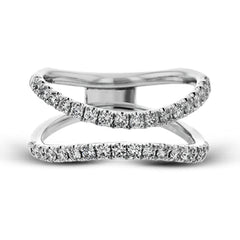 This distinctive bridal set design features a double-layer wedding band that fits around the engagement ring. The set contains .77 ctw of white diamonds.