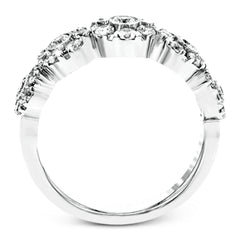 This whimsical white gold ring features .78 ctw of round white diamonds accentuated by .07 ctw of round pink diamonds as well as rose gold details in a playful floral design.