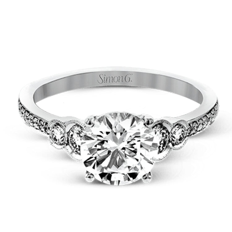 Timelessly beautiful, this white gold engagement ring's stunning design features .44 ctw of round white diamonds flanking the center stone with a lovely tapered effect.