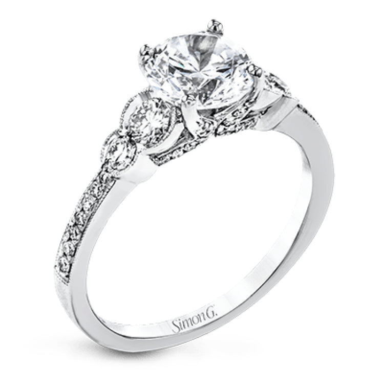 Timelessly beautiful, this white gold engagement ring's stunning design features .44 ctw of round white diamonds flanking the center stone with a lovely tapered effect.