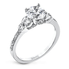 Timelessly beautiful, this white gold engagement ring's stunning design features .44 ctw of round white diamonds flanking the center stone with a lovely tapered effect.