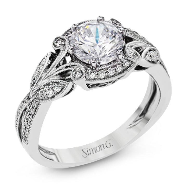 This amazing 18k white gold engagement ring features vintage-inspired design elements set with .28 ctw of white diamonds.