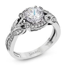 This amazing 18k white gold engagement ring features vintage-inspired design elements set with .28 ctw of white diamonds.