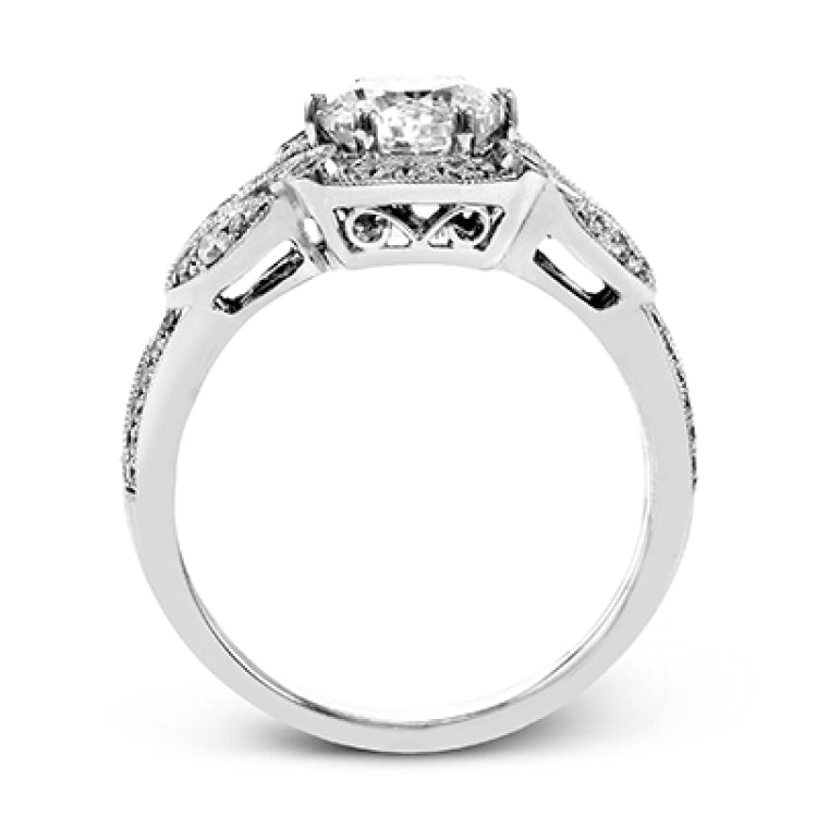 This amazing 18k white gold engagement ring features vintage-inspired design elements set with .28 ctw of white diamonds.