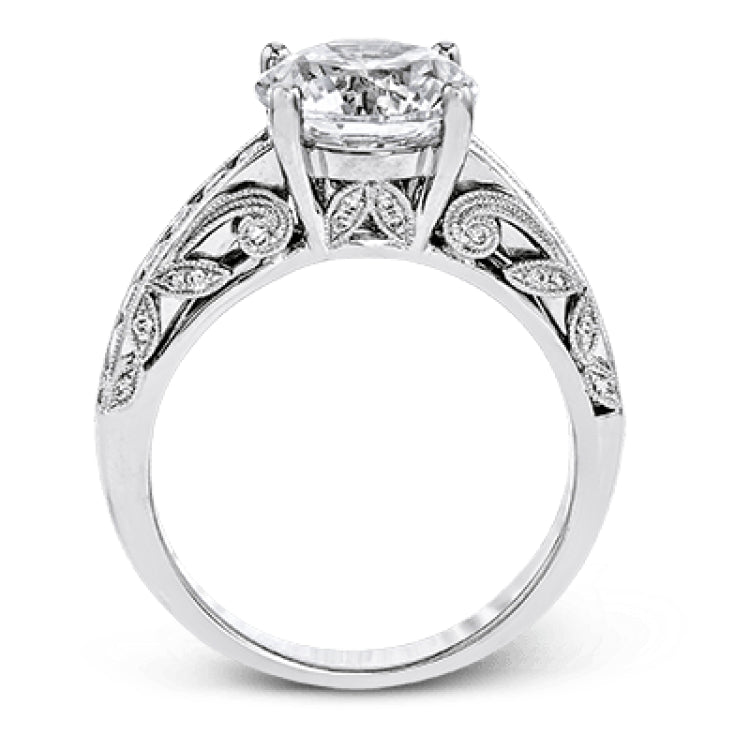 This 18k white gold engagement ring has a design taken from nature with leaves and filigree set with .43 ctw of white diamonds.
