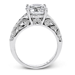This 18k white gold engagement ring has a design taken from nature with leaves and filigree set with .43 ctw of white diamonds.