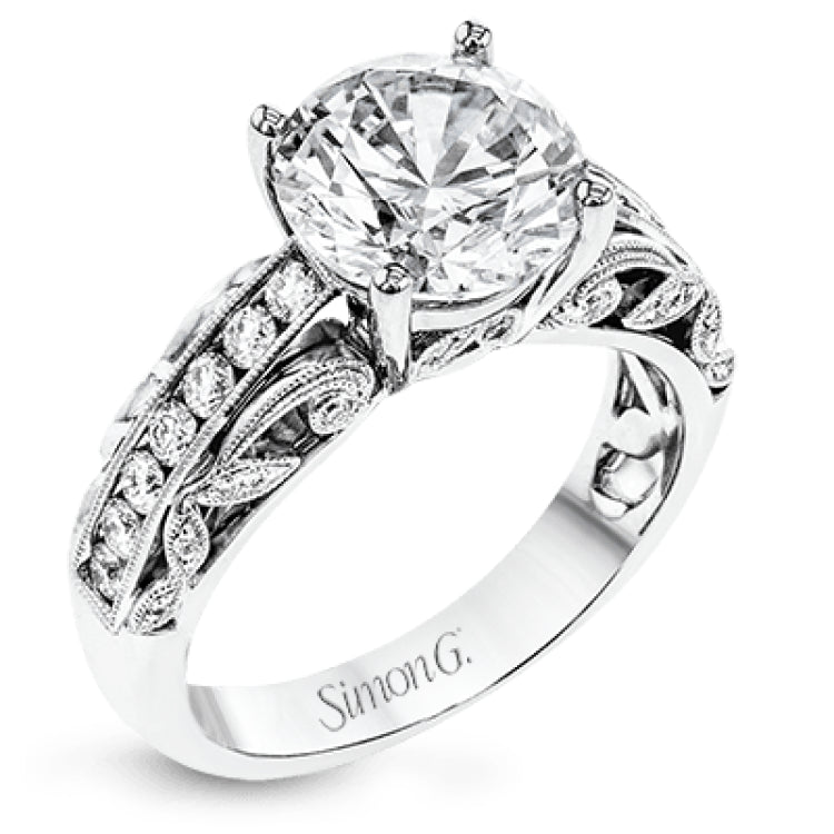 This 18k white gold engagement ring has a design taken from nature with leaves and filigree set with .43 ctw of white diamonds.