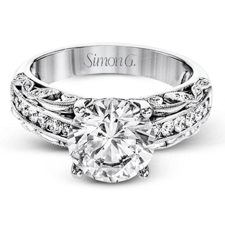 This 18k white gold engagement ring has a design taken from nature with leaves and filigree set with .43 ctw of white diamonds.