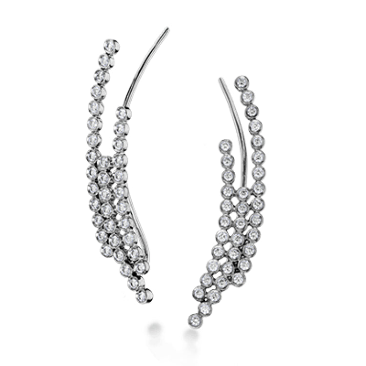 These fashionable climber earrings contain a stunning .62 ctw of white diamonds bezel set into a modern 18k gold design.