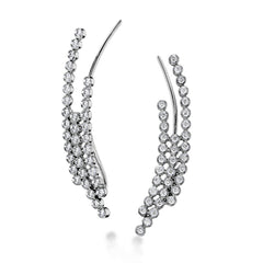 These fashionable climber earrings contain a stunning .62 ctw of white diamonds bezel set into a modern 18k gold design.