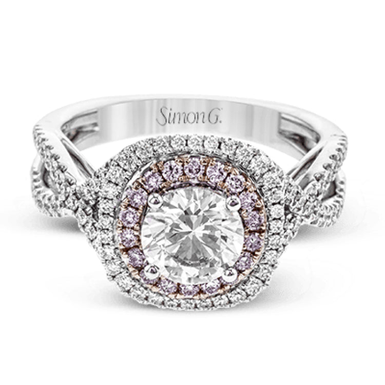 This lovely halo engagement ring is crafted in tones of 18k rose and white gold and contains .36 ctw of white diamonds along with .18 ctw of pink diamonds.