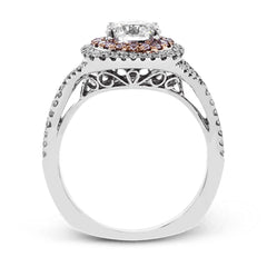 This lovely halo engagement ring is crafted in tones of 18k rose and white gold and contains .36 ctw of white diamonds along with .18 ctw of pink diamonds.
