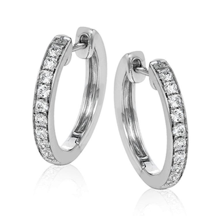 These darling 18k white gold hoop earrings contain .34 ctw of white diamonds, and are the perfect delicate size to wear everyday.