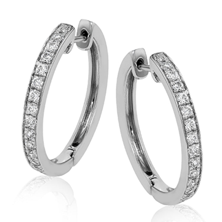 These medium-sized hoop earrings feature .50 ctw of white diamonds and are crafted from 18k white gold.