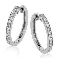 These medium-sized hoop earrings feature .50 ctw of white diamonds and are crafted from 18k white gold.