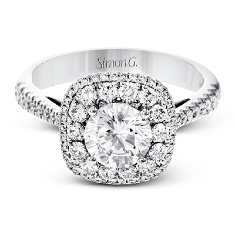 This 18k white gold engagement ring setting has a stunning double halo design set with .61 ctw of shining white round brilliant diamonds.