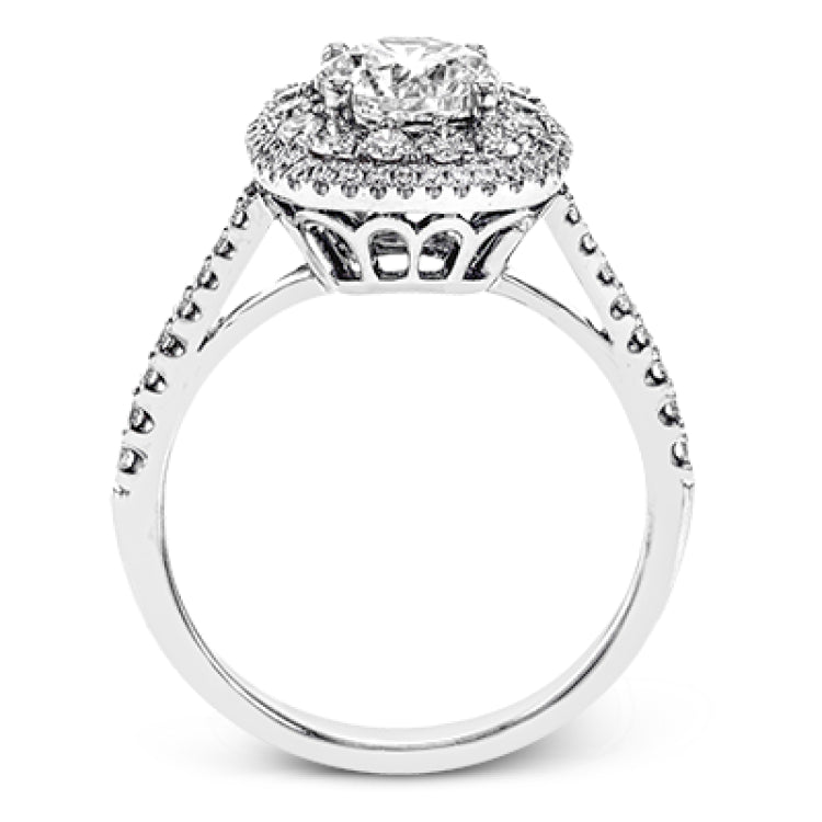 This 18k white gold engagement ring setting has a stunning double halo design set with .61 ctw of shining white round brilliant diamonds.