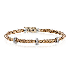 This wonderful bracelet is woven from pure 18k rose gold, with a rich warmth which sets off the .33 ctw of white diamonds in its midst. Perfect for stacking.