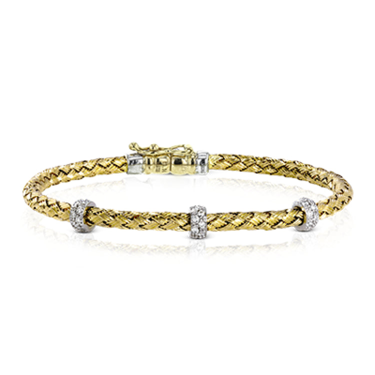 This wonderful 18k yellow gold woven bracelet contains .33 ctw of white diamonds, adding an opulent touch which can still be worn everyday. Perfect for stacking.