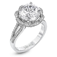 This lovely 18k white gold engagment setting features a wavy halo reminiscent of an opening flower set with .50 ctw of white diamonds.