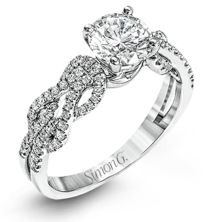This distinctive 18k white gold ring has an intricate design reminiscent of lover's knots and eternity symbols, set with .33 ctw of white diamonds.