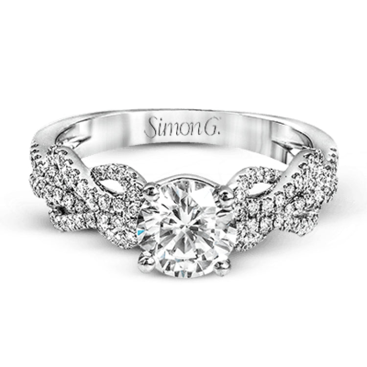 This distinctive 18k white gold ring has an intricate design reminiscent of lover's knots and eternity symbols, set with .33 ctw of white diamonds.