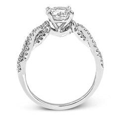 This distinctive 18k white gold ring has an intricate design reminiscent of lover's knots and eternity symbols, set with .33 ctw of white diamonds.