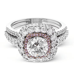 This bold design combines tones of pink and white with 1.11 ctw of sparkling white diamonds in 18k white gold complimenting .07 ctw of pink diamonds in 18k rose gold.