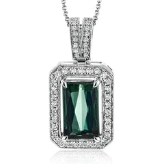 This graceful 18k white gold pendant features a 4.25 ct rectangular green tourmaline in the center, surrounded by .30 ctw of white diamonds.