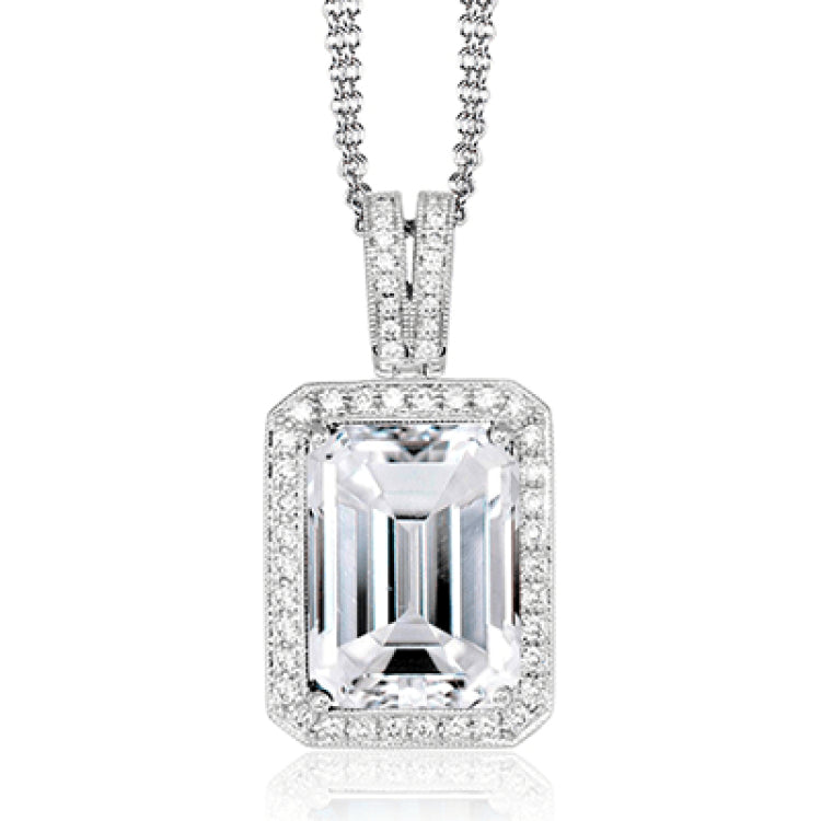 This graceful 18k white gold pendant features a 4.25 ct rectangular green tourmaline in the center, surrounded by .30 ctw of white diamonds.