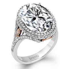 A beautiful 7.55 ct oval rubellite sits at the center of this enchanting 18k white gold ring with accents of 18k rose gold. A beautiful .70 ctw of white diamonds finishes this lovely design.