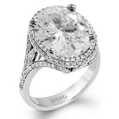 A beautiful 7.55 ct oval rubellite sits at the center of this enchanting 18k white gold ring with accents of 18k rose gold. A beautiful .70 ctw of white diamonds finishes this lovely design.