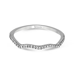This 18k white gold wedding set has a distinctive design with a milgrain accented bezel center stone setting, .15 ctw pear side stones, and .50 ctw of round brilliant diamonds.