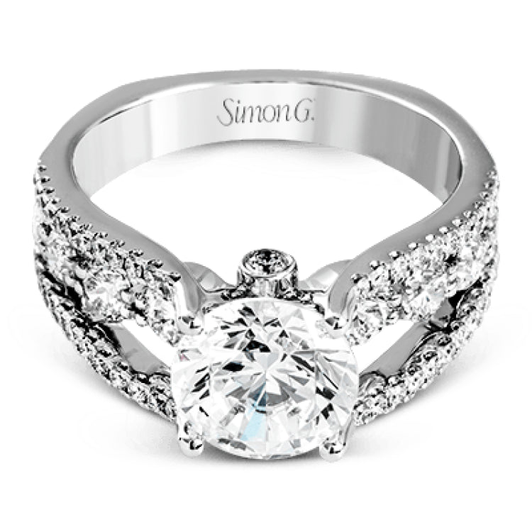 This 18k white gold engagment ring is a modern take on a classic design with 1.12 ctw of round white diamonds.