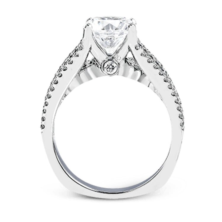 This 18k white gold engagment ring is a modern take on a classic design with 1.12 ctw of round white diamonds.