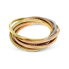 This lovely rolling ring combines three different colors of 18k gold, accented by rows of .80 ctw of white round brilliant diamonds.