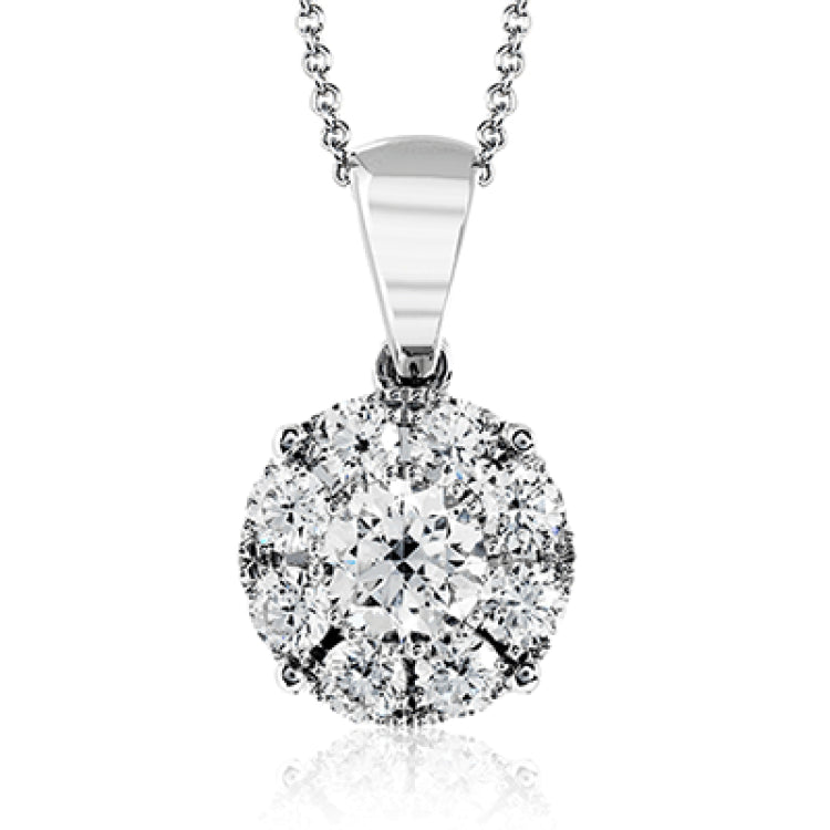 This lovely round 18k white gold pendant features .40 ctw of smaller diamonds grouped around a center .30 ct diamond.
