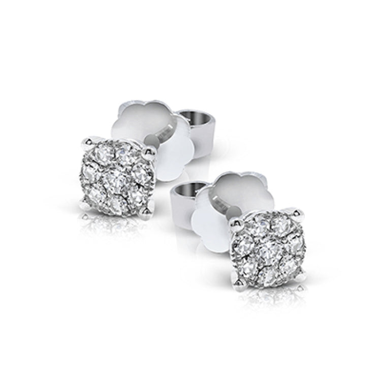 These 18k white gold stud earrings are a classic choice with a grouping of .26 ctw of round diamonds encircling .30 ctw round center diamonds.