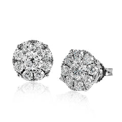 This stud earrings are a modern update on a classic, with .80 ctw of round white diamonds surrounding .63 ctw center diamonds.